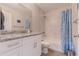 Bright bathroom featuring white cabinetry, granite countertops, tub/shower combination, and modern fixtures, clean updated space at 13662 Se 55Th Ave, Summerfield, FL 34491