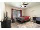 Bedroom featuring wood-look floors, modern lighting, and a minimalist design offering a calm and uncluttered space at 13662 Se 55Th Ave, Summerfield, FL 34491