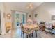 Bright dining area with access to the backyard, with casual furniture and natural lighting at 13662 Se 55Th Ave, Summerfield, FL 34491