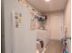 Functional laundry room with washer, dryer, and storage solutions, offering convenience and organization for household tasks at 13662 Se 55Th Ave, Summerfield, FL 34491