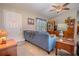 Comfortable living room with plenty of seating, neutral paint, and plenty of natural light at 13662 Se 55Th Ave, Summerfield, FL 34491