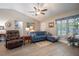 Cozy living room with comfortable seating, stylish decor, and plenty of light at 13662 Se 55Th Ave, Summerfield, FL 34491