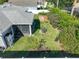 Spacious yard featuring lawn, plantings, garden, and enclosed patio at 1407 Island Cove Dr, Deland, FL 32724