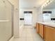 Clean bathroom featuring a glass shower, double sink vanity, and natural lighting at 1407 Island Cove Dr, Deland, FL 32724