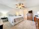 Bedroom featuring nautical themed decor, wood furniture, and carpeted floors at 1407 Island Cove Dr, Deland, FL 32724