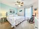 Comfortable bedroom with coastal decor, soft lighting, and a relaxing rocking chair at 1407 Island Cove Dr, Deland, FL 32724