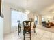 Dining area featuring tile flooring, bright natural light and decorative chandelier at 1407 Island Cove Dr, Deland, FL 32724