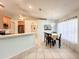 Dining area featuring tile flooring, bright natural light, and adjacent kitchen at 1407 Island Cove Dr, Deland, FL 32724