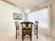 Dining area featuring tile flooring, bright natural light and decorative chandelier at 1407 Island Cove Dr, Deland, FL 32724