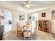 Open concept dining room featuring a round table with chairs, and stylish home decor at 1407 Island Cove Dr, Deland, FL 32724