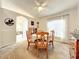 Airy dining room showcasing a round table and archways leading to the rest of the house at 1407 Island Cove Dr, Deland, FL 32724