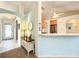 Inviting entryway with tile floors, arched doorway, and decorative console table creating a warm welcome at 1407 Island Cove Dr, Deland, FL 32724