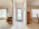 Foyer with decorative glass front door that shows entrances to dining room, and living room at 1407 Island Cove Dr, Deland, FL 32724