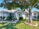 Inviting single-Gathering home featuring a lush front yard, shade tree and traditional architectural design at 1407 Island Cove Dr, Deland, FL 32724