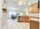 Open kitchen featuring stainless steel appliances, light wood cabinetry, and a dining area at 1407 Island Cove Dr, Deland, FL 32724