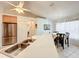 Bright kitchen featuring stainless steel appliances, dual basin sink and an open dining area with natural light at 1407 Island Cove Dr, Deland, FL 32724