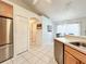 Well-designed kitchen with stainless appliances, access to other rooms, and ample storage at 1407 Island Cove Dr, Deland, FL 32724