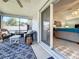 Relax on this screened lanai with seating and an opening to the Primary bedroom at 1407 Island Cove Dr, Deland, FL 32724