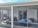 Lanai with a ceiling fan and views of the backyard and Primary bedroom at 1407 Island Cove Dr, Deland, FL 32724