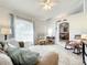 Cozy living room with carpet, large windows, and comfortable furnishings at 1407 Island Cove Dr, Deland, FL 32724
