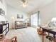 Inviting living room featuring a ceiling fan and comfortable seating with a window view at 1407 Island Cove Dr, Deland, FL 32724