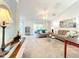 Inviting living room with plush carpeting, vaulted ceilings, and sliding glass doors to the outside at 1407 Island Cove Dr, Deland, FL 32724