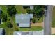 Aerial shot of home highlighting roof condition and landscaping at 1541 Doral Cir, Lady Lake, FL 32159