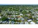 Aerial view of a residential area with lush greenery and manicured lawns at 1541 Doral Cir, Lady Lake, FL 32159