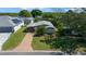 Charming home with a well-kept lawn and long driveway at 1541 Doral Cir, Lady Lake, FL 32159