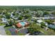 A picturesque aerial view of the community's pool, parking area, and adjacent homes at 1541 Doral Cir, Lady Lake, FL 32159