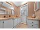 This bathroom features a copper sink, adjacent laundry, and neutral walls at 1541 Doral Cir, Lady Lake, FL 32159