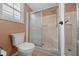 This bathroom features a step in shower and toilet at 1541 Doral Cir, Lady Lake, FL 32159