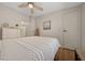 Inviting bedroom with warm wood floors and light, airy decor at 1541 Doral Cir, Lady Lake, FL 32159