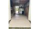 Spacious garage offers a clean concrete floor and easy access to the outdoors at 1541 Doral Cir, Lady Lake, FL 32159