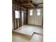 Clean garage with exposed framework and a newly finished concrete floor at 1541 Doral Cir, Lady Lake, FL 32159