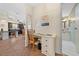 Hallway featuring a built-in desk with easy access to kitchen and bathroom at 1541 Doral Cir, Lady Lake, FL 32159