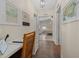 Hallway features a desk, and a bedroom visible through an open door at 1541 Doral Cir, Lady Lake, FL 32159