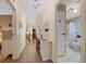 Hallway with a view into the living area and with entrances to the bathroom and bedroom at 1541 Doral Cir, Lady Lake, FL 32159