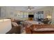 Well-lit living room with cozy seating, natural light, and easy access to the patio at 1541 Doral Cir, Lady Lake, FL 32159
