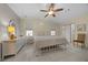 Serene bedroom featuring a queen bed, tile floors, and bright natural light at 1541 Doral Cir, Lady Lake, FL 32159