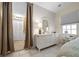 The main bedroom features neutral walls and an en-suite bathroom at 1541 Doral Cir, Lady Lake, FL 32159