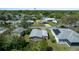 The rear exterior of the house is shown from an aerial view at 1541 Doral Cir, Lady Lake, FL 32159