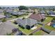 Aerial view of a home and its neighborhood featuring a backyard, lush landscaping, and a pool at 1589 Armstrong Ave, The Villages, FL 32163