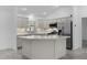Well-equipped kitchen featuring stainless steel appliances, shaker cabinets and mosaic tile backsplash at 1589 Armstrong Ave, The Villages, FL 32163