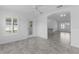 Well-lit room with tile flooring features a ceiling fan and view of other rooms at 1589 Armstrong Ave, The Villages, FL 32163
