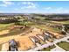 Stunning aerial view of luxury homes overlooking a lush golf course and picturesque landscape at 16028 Trivoli Cir, Montverde, FL 34756