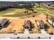 A nice aerial view of multiple homes near a golf course at 16028 Trivoli Cir, Montverde, FL 34756