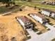 A nice aerial view of two homes on a sunny day at 16028 Trivoli Cir, Montverde, FL 34756