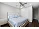 This bedroom features wood floors, fan, and a closet at 16028 Trivoli Cir, Montverde, FL 34756