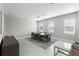 Bright dining area with tile floors, modern light fixture, and a view to the living space at 16028 Trivoli Cir, Montverde, FL 34756